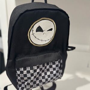 Vans Black and White Checkered Backpack with Skull Design